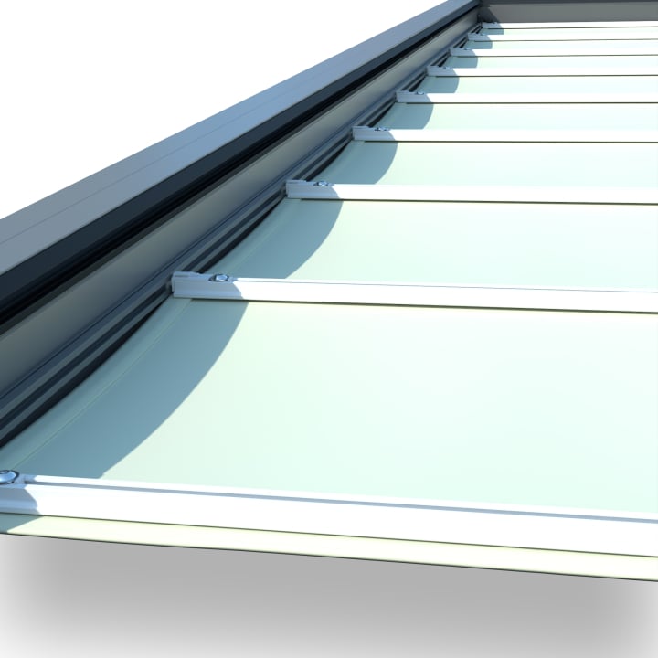 Track-guided retractable patio shade below a glass patio roof